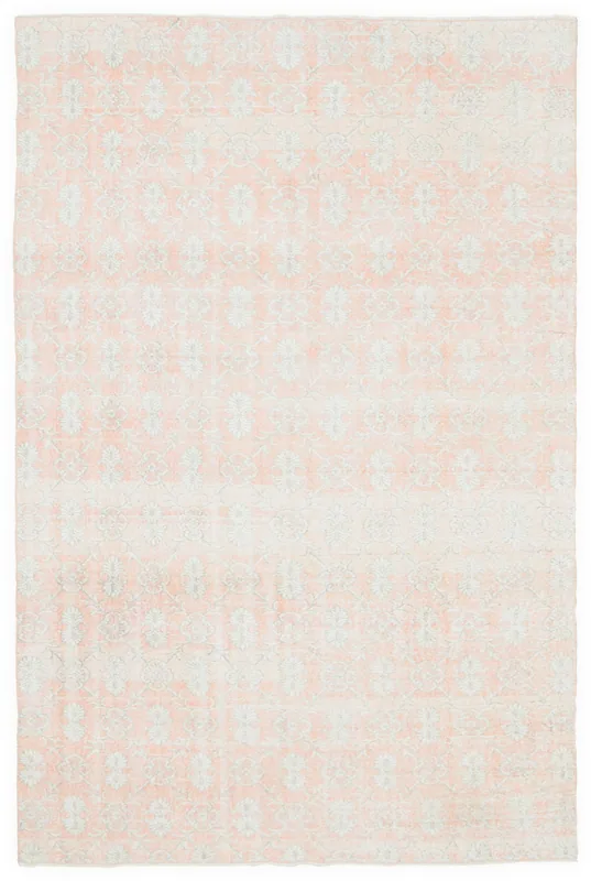 Full overhead view of the 6'7" x 10'4" vintage rose Anatolian rug on a white background