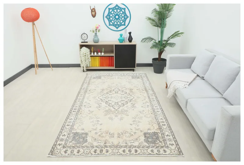 Full top view of the 4'9" x 8'8" ivory and gray vintage Anatolian rug on a white background.