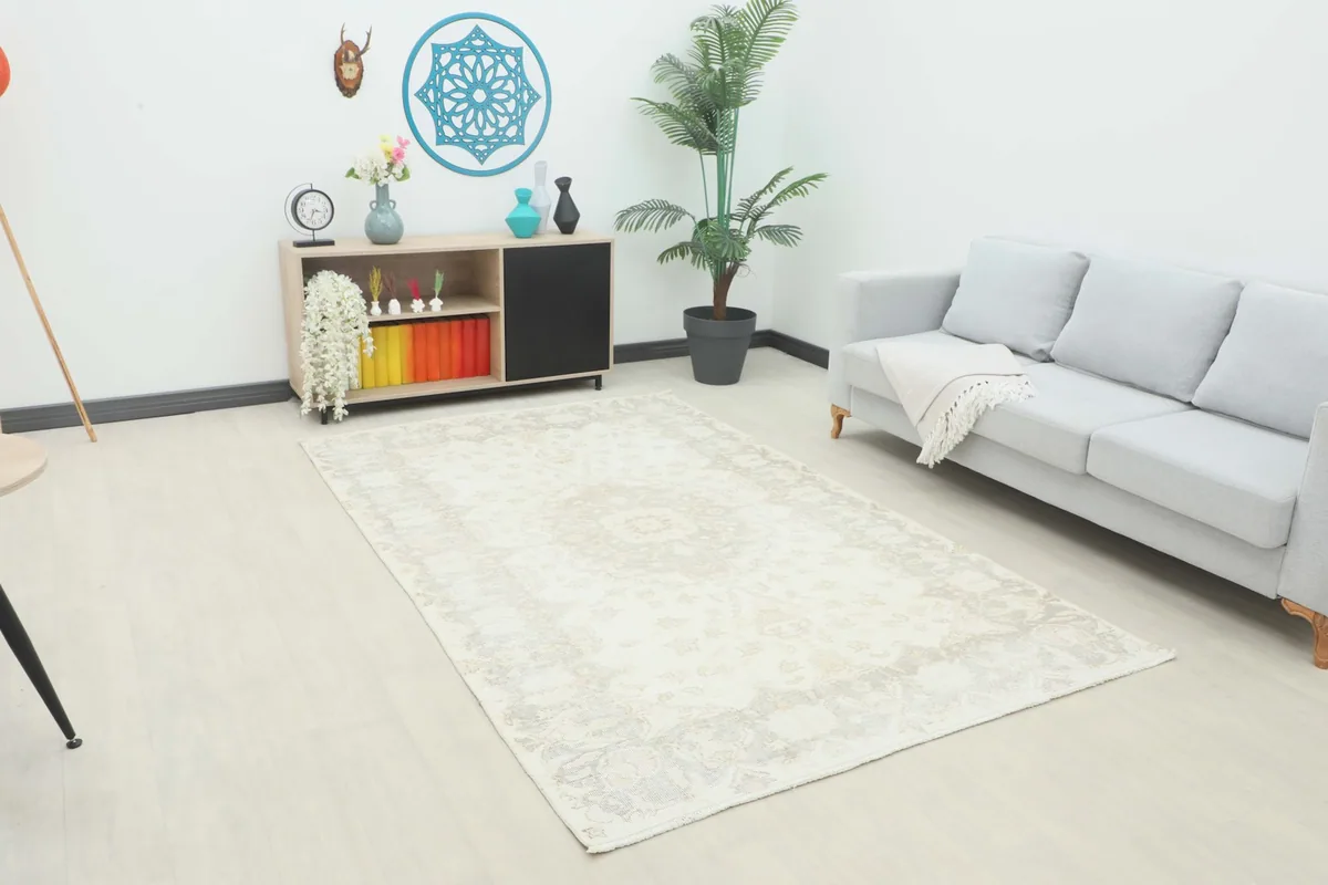 Ivory and gray medallion rug placed in a modern living room setting