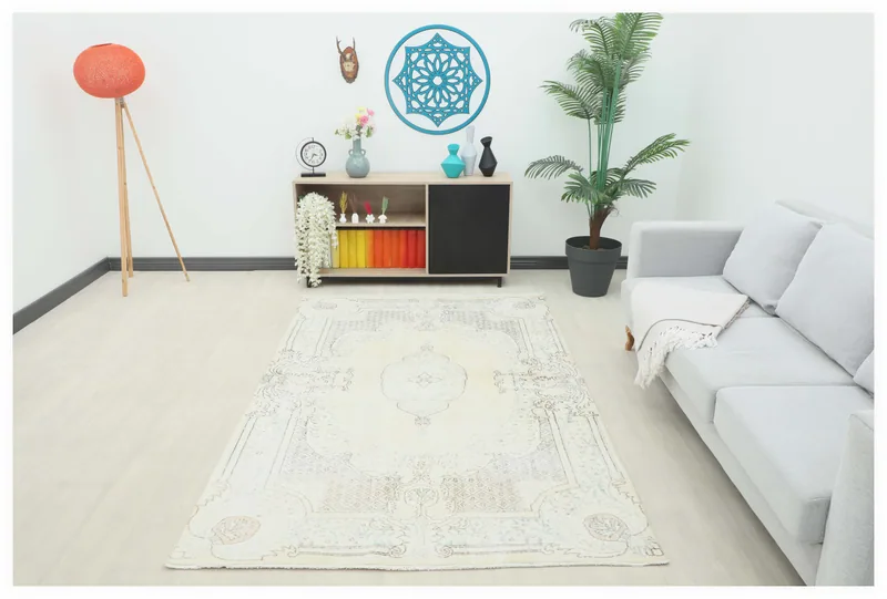 Full top view of the 5'1" x 8'1" vintage ivory and beige Anatolian rug