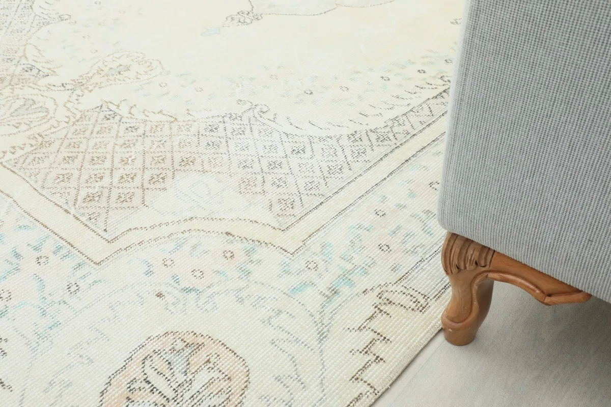 Close-up of the rug's pattern next to a furniture leg