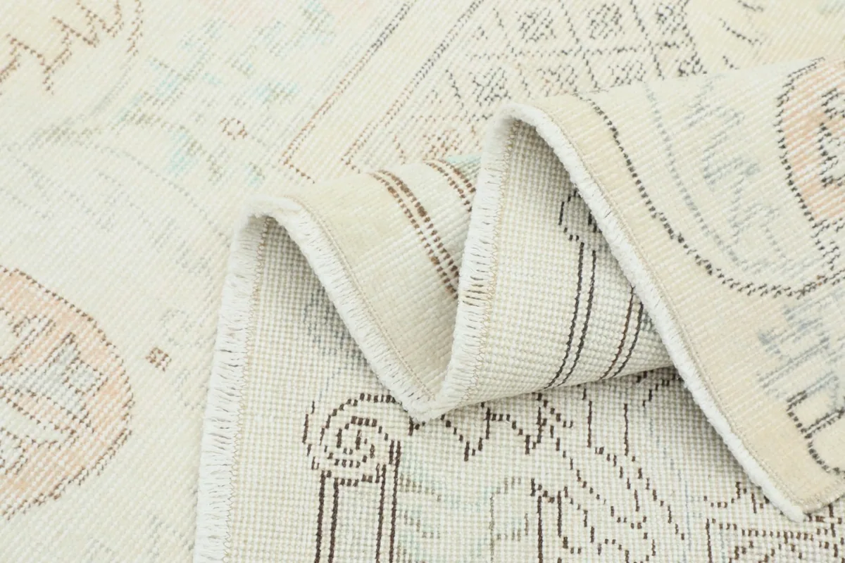 Folded section of the rug, revealing the texture and foundation