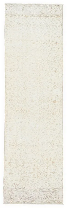 Full overhead view of the 2'6" x 8'6" cream vintage Anatolian runner rug on a white background.