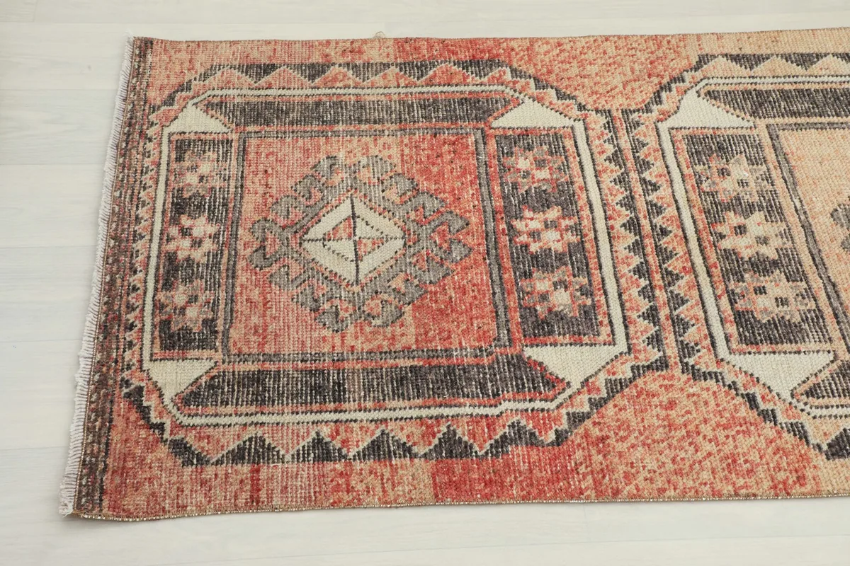 Detailed view of the runner's surface, showing the repeating geometric patterns and colors.