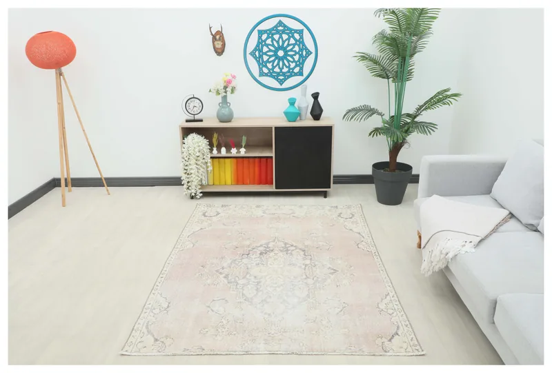 Full overhead view of the Muted Rose Medallion Anatolian rug on a white background.