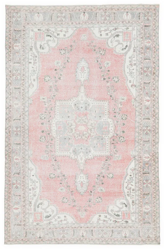 Full top view of the 6'2" x 10'0" vintage rose and gray Anatolian rug with a central medallion.