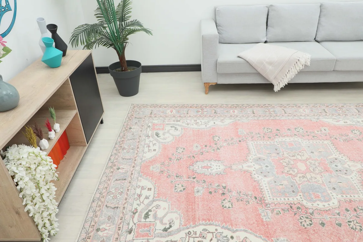 Angle view of the large vintage rug complementing the decor in a contemporary living space.