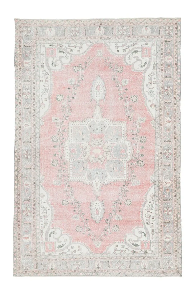 Full overhead view of the vintage rose and gray Anatolian rug, showcasing its complete design.