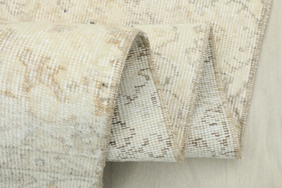Another view of the rug folded, highlighting the texture and color variations in the pile.