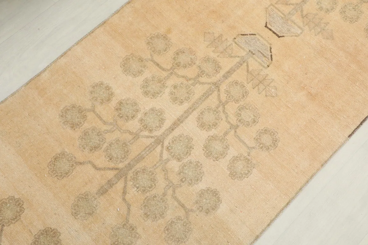 Overhead detail of the central part of the runner, showing the repeating tree motif design