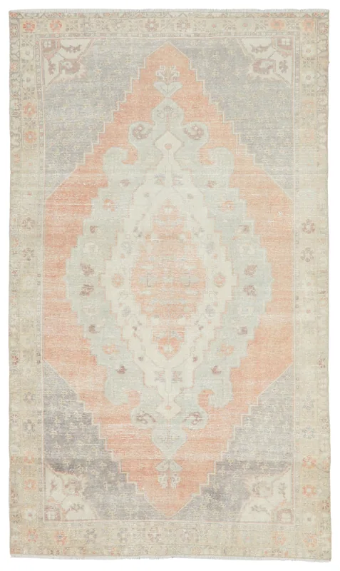 Full overhead view of the rust and gray medallion vintage Anatolian rug on a white background.