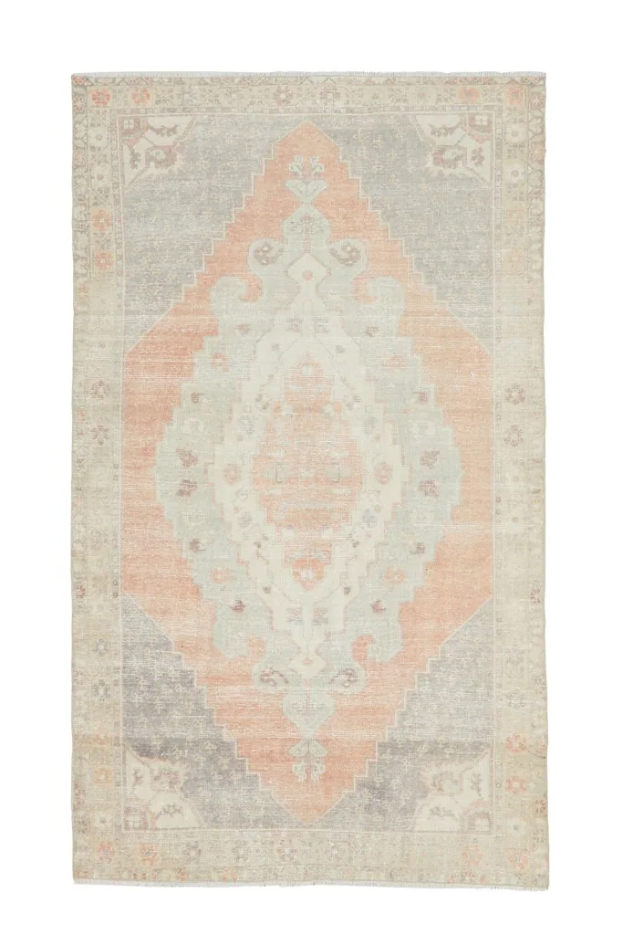 Full overhead view of the vintage Anatolian rug, presenting its complete design and colors.