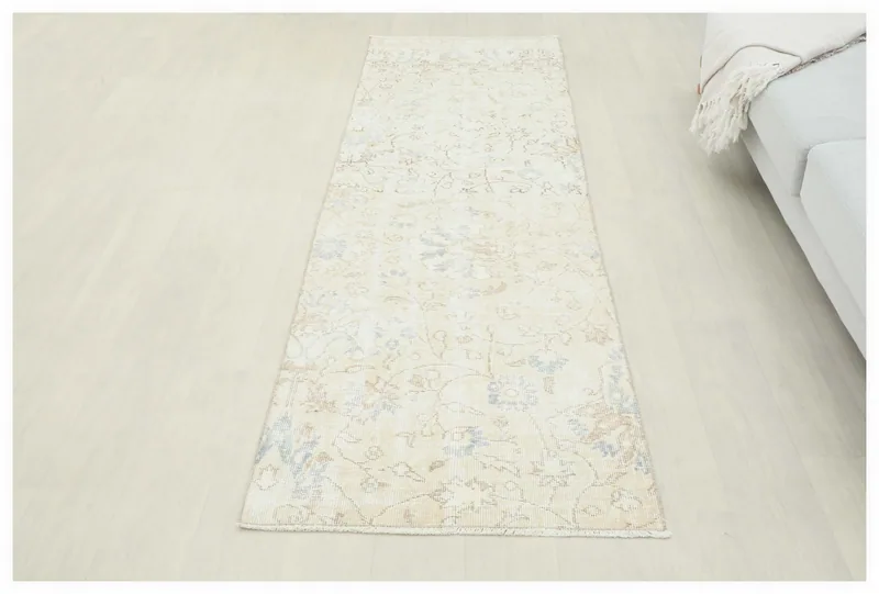 Full top view of the beige floral vintage runner on a white background.