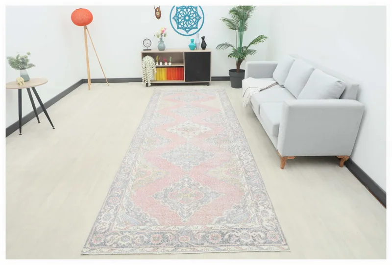 Full top view of the 4'7" x 12'6" pink geometric Anatolian runner on a white background.