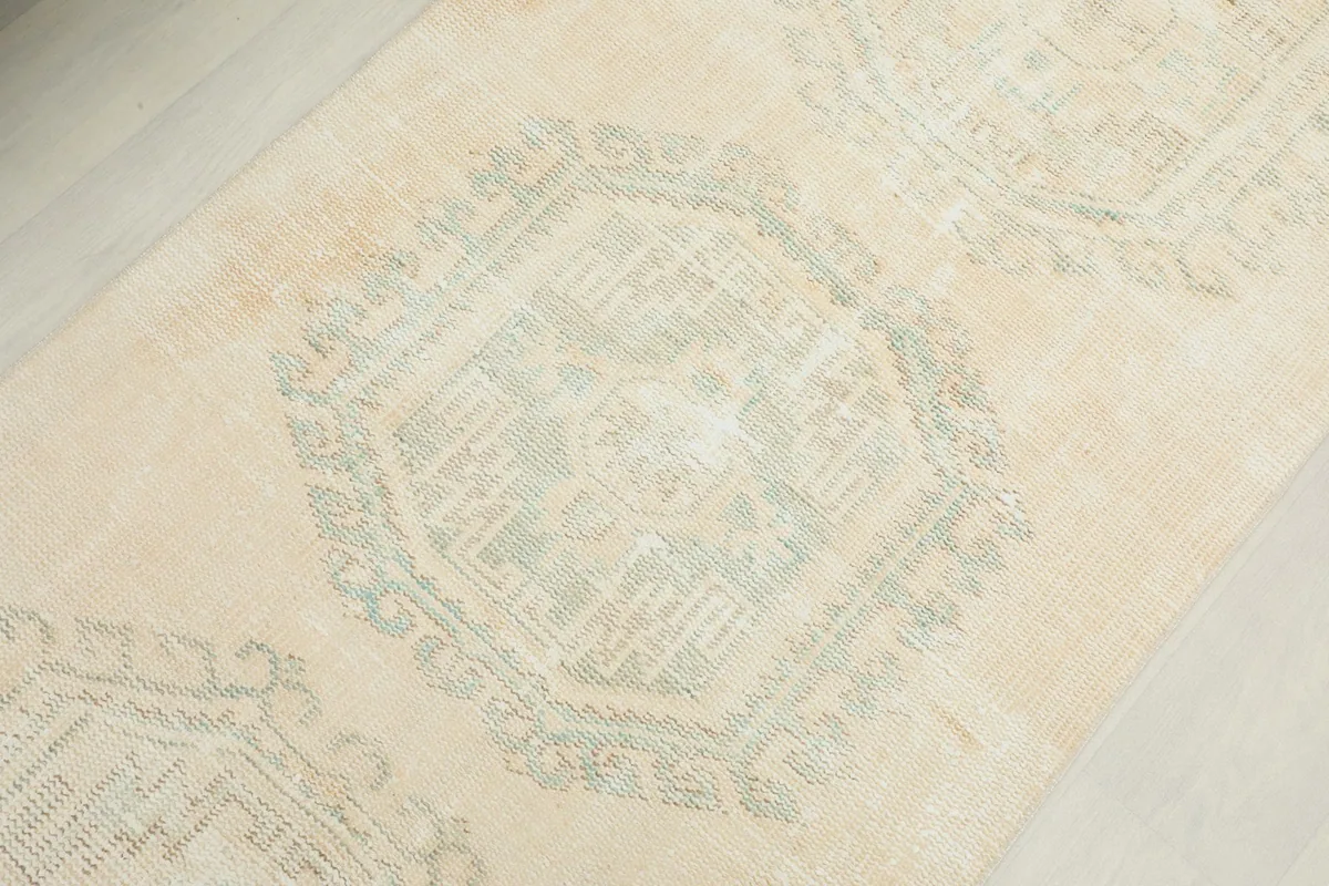 Overhead close-up of the central geometric design elements and soft color variations