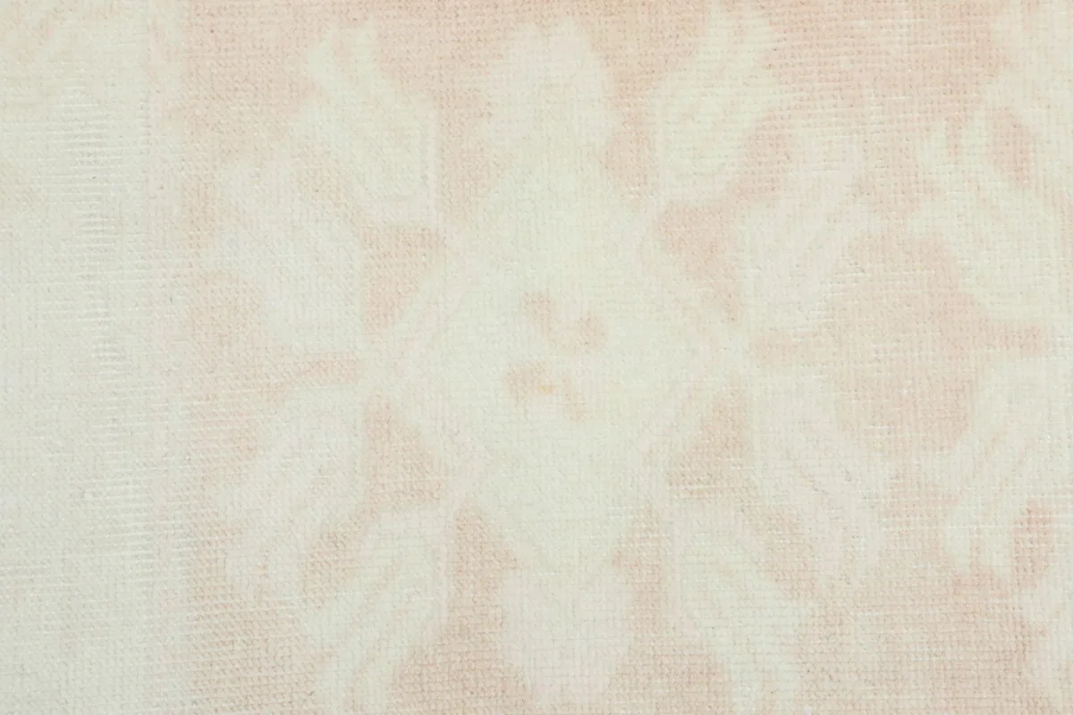 Detailed view of the central floral motif with soft color variations