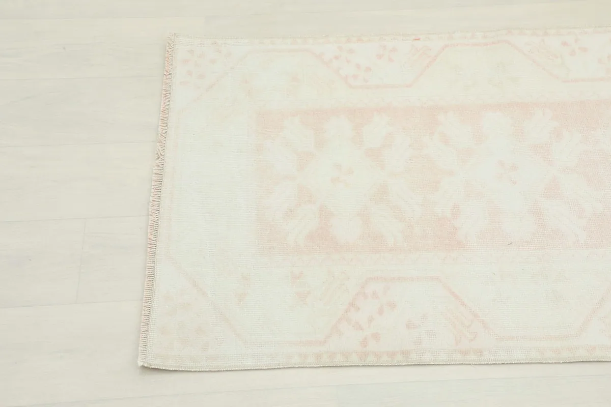 Detail of the side border and corner motif of the hand-knotted rug