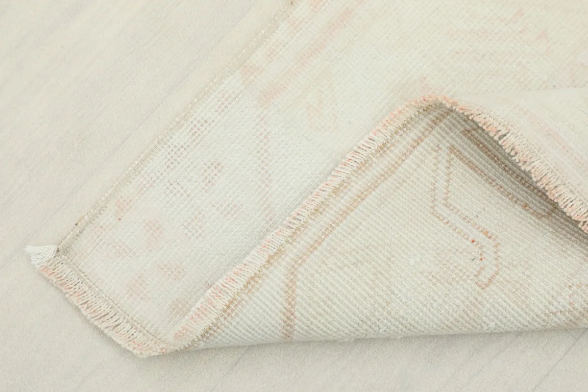 Underside view showing the hand-knotted cotton foundation and wool pile