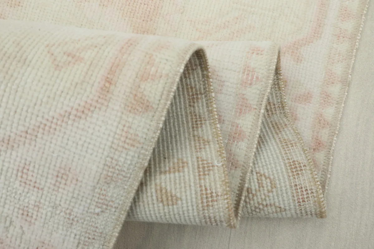Folded view demonstrating the flexibility and texture of the wool rug