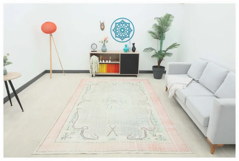 Full top view of the 6x9 cream and rose vintage area rug on a white background