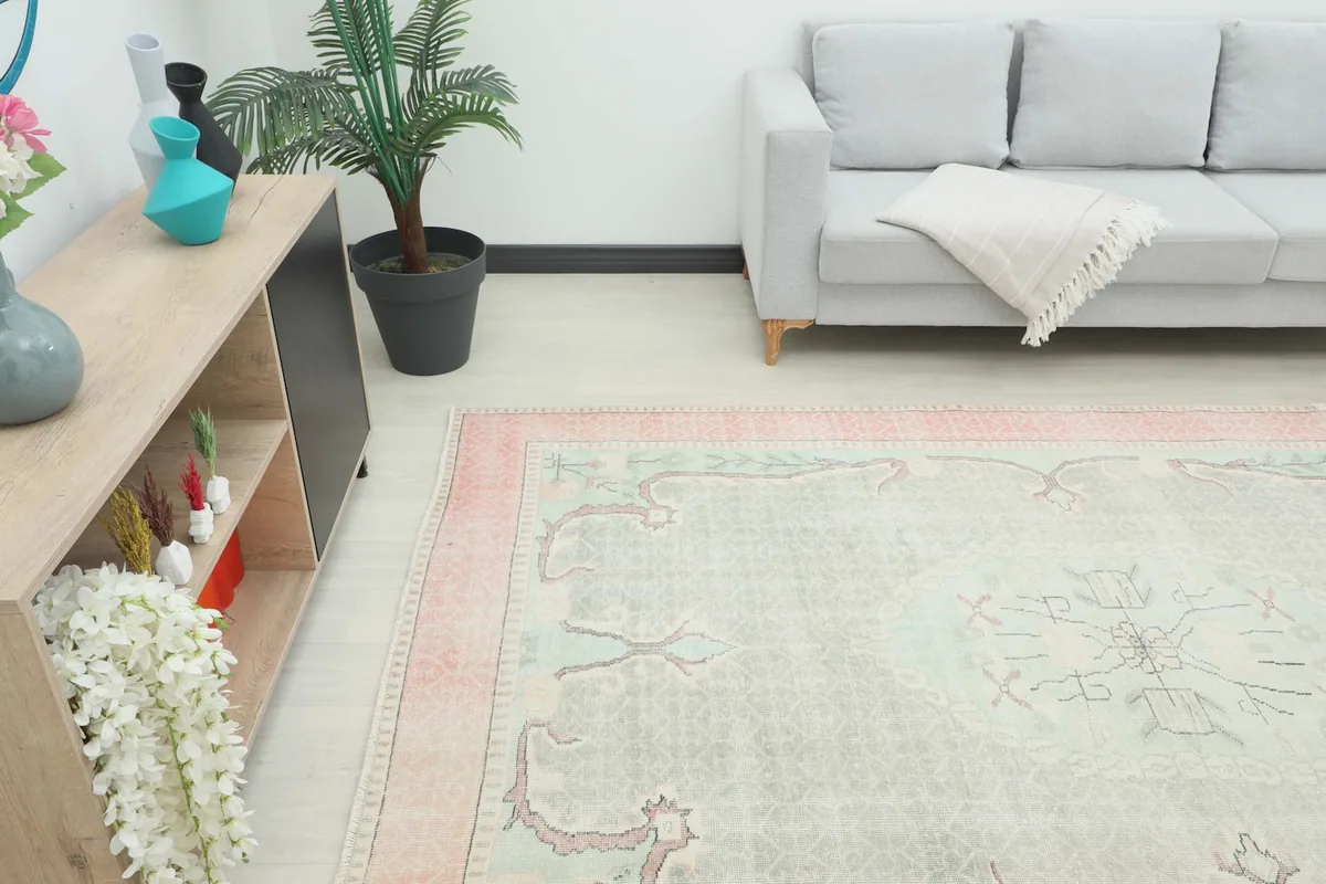 Angle view of the rug in a living room, showing its placement relative to furniture