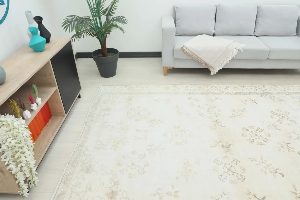 Angle view of the ivory beige floral rug in a living room setup