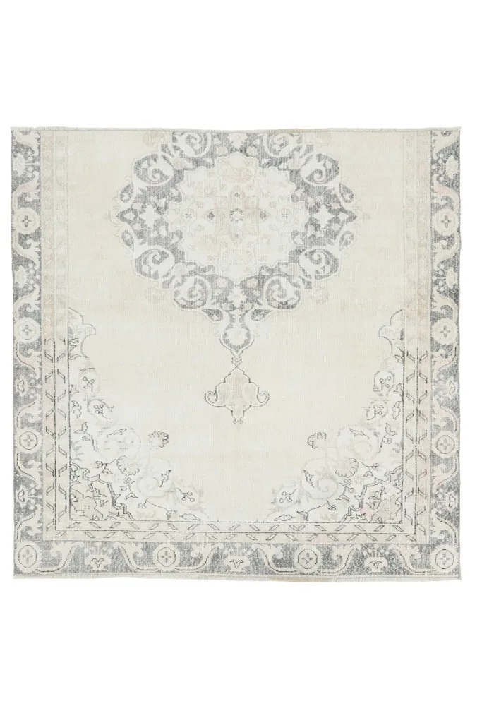 Full overhead view of the ivory and gray vintage Anatolian rug, showcasing its complete design.