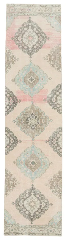 Full overhead view of the beige, pink, blue, and gray vintage Anatolian runner