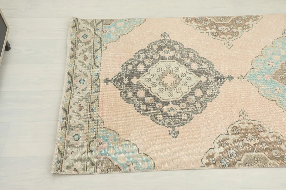 Close-up of another section of the runner, featuring a blue and gray geometric medallion