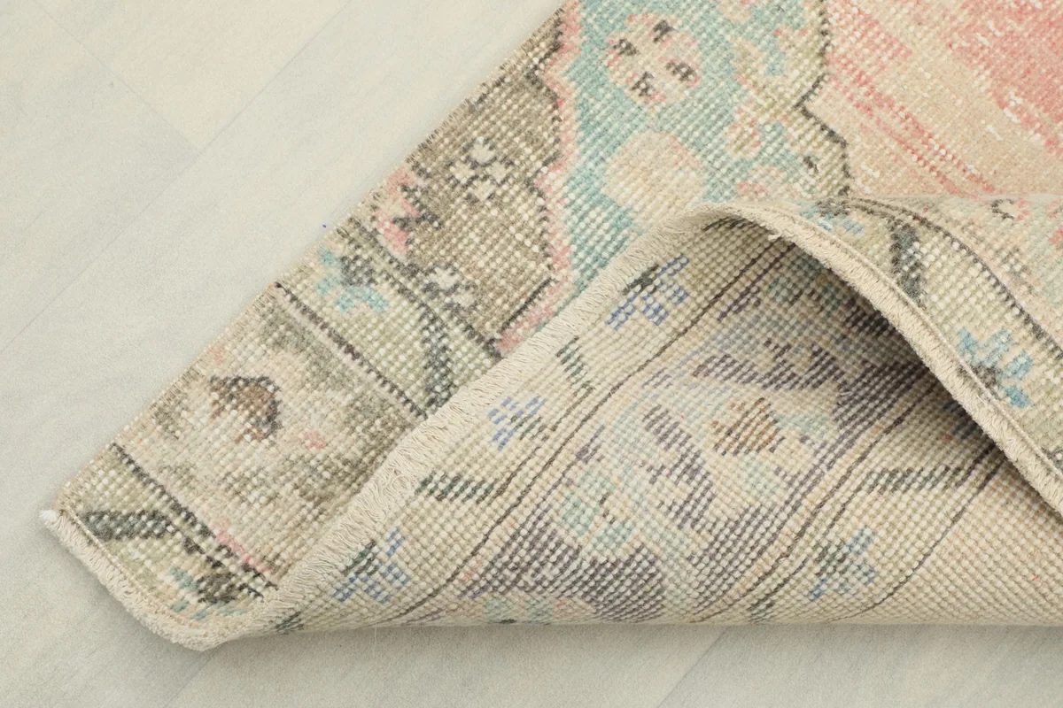View of the underside of the runner, showing the cotton foundation and hand-knotted construction