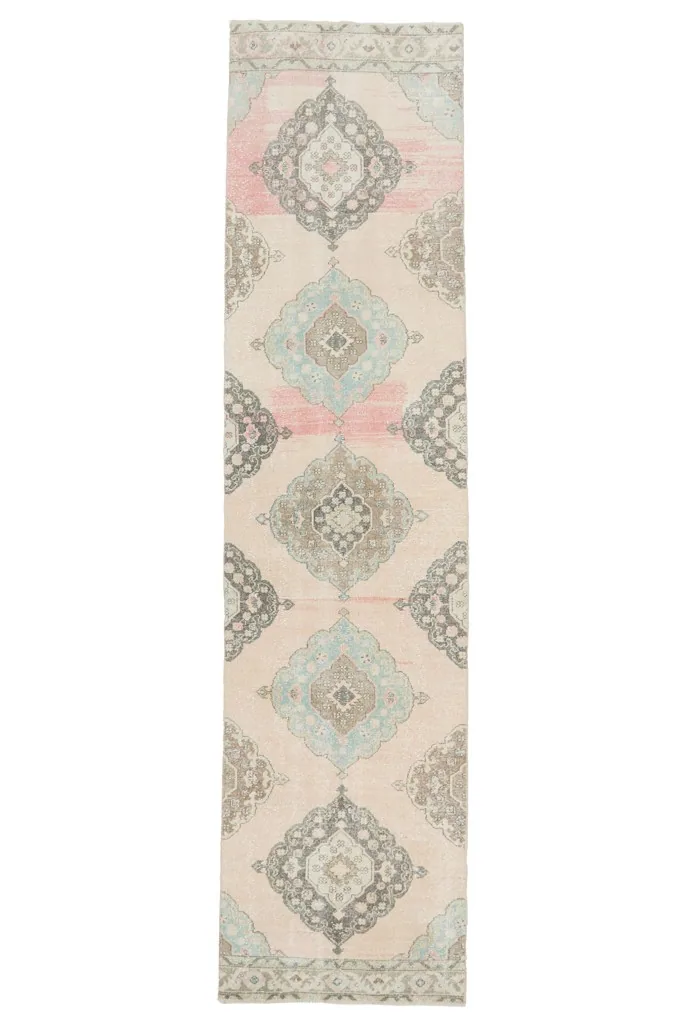 Full overhead view of the vintage Anatolian runner, showing its entire length and design on a white background