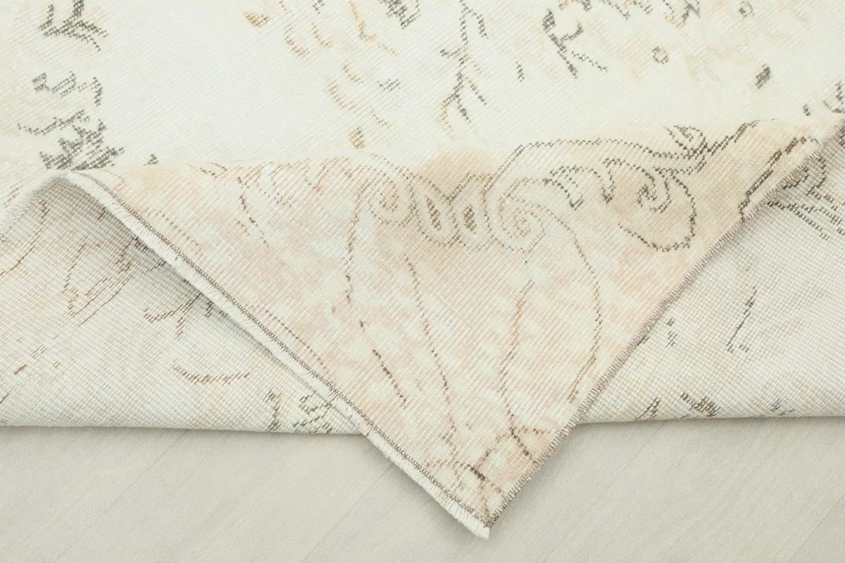 Underside of the hand-knotted rug, revealing the cotton foundation and knotting