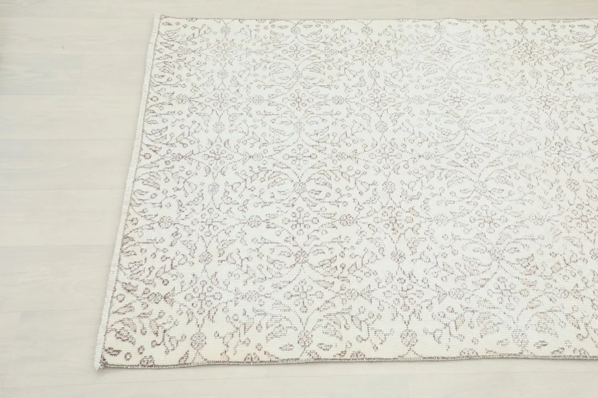 Detailed view of the rug's pattern and subtle color variations from a different angle.