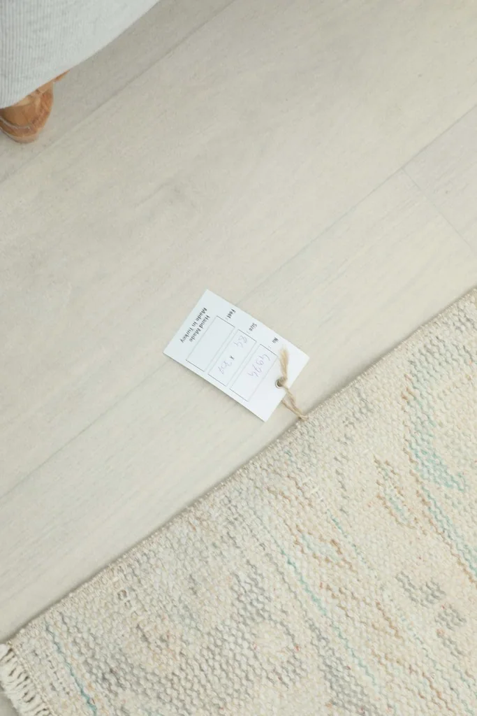 Rugskilim tag attached to the corner of the runner, indicating product information