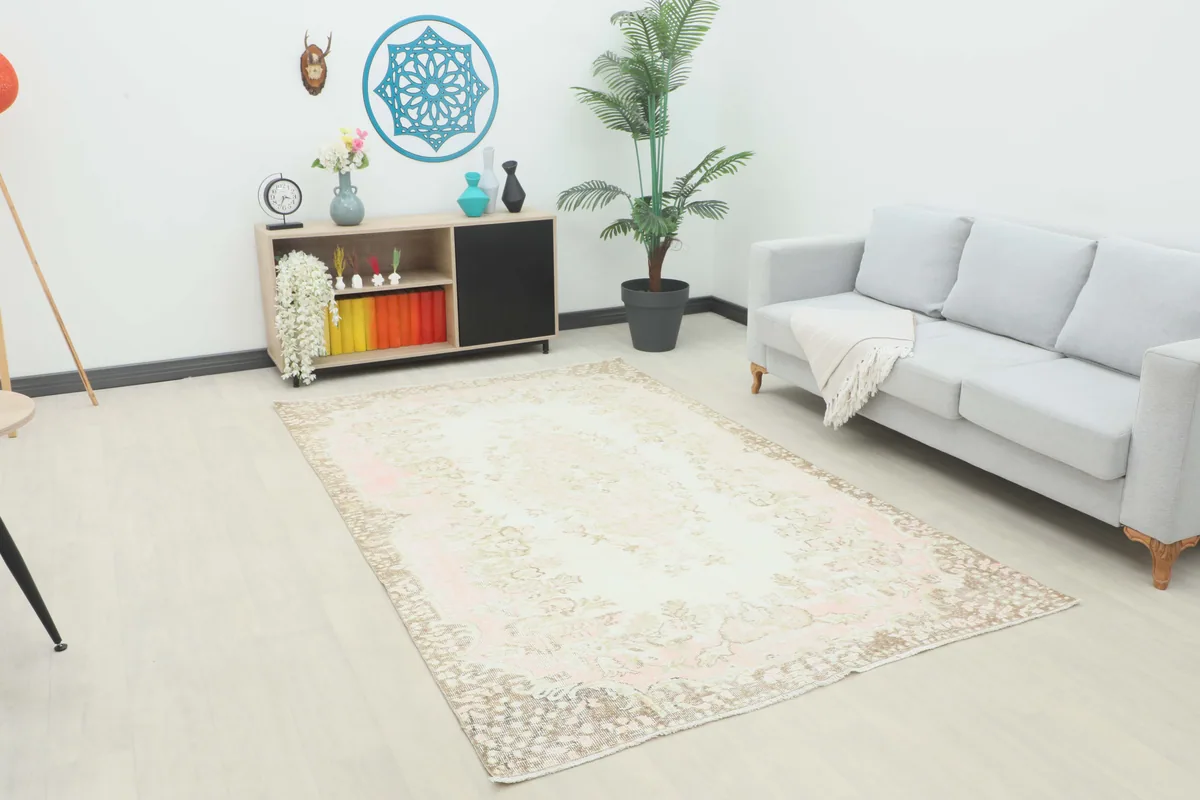 Soft Rose Floral Medallion Rug in a modern living room setting, full top view.