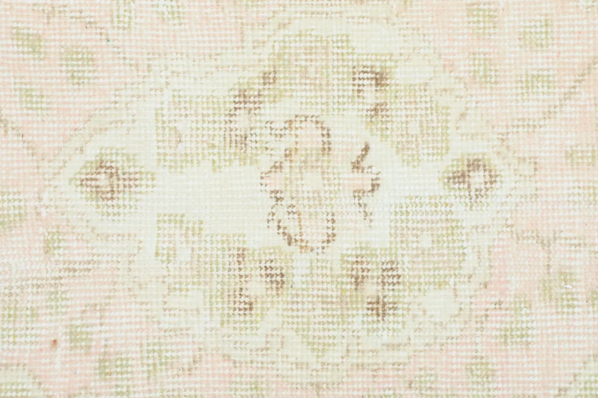 Detailed view of the central medallion on the Soft Rose Floral Medallion Rug, highlighting the faded design.
