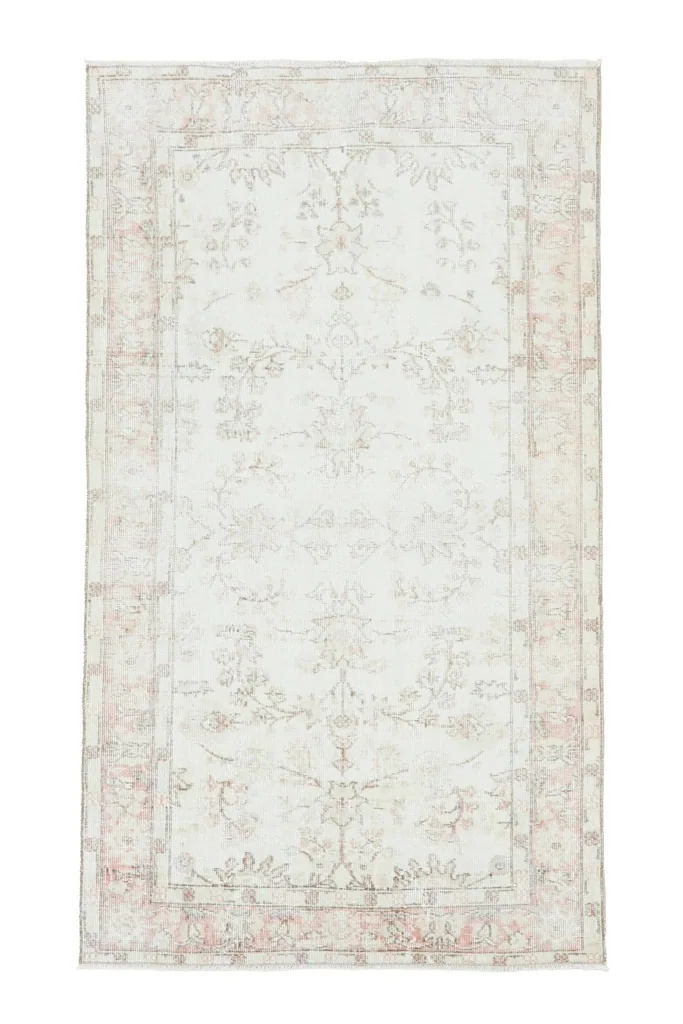 Full overhead shot of the ivory and rose Anatolian rug on a white background.