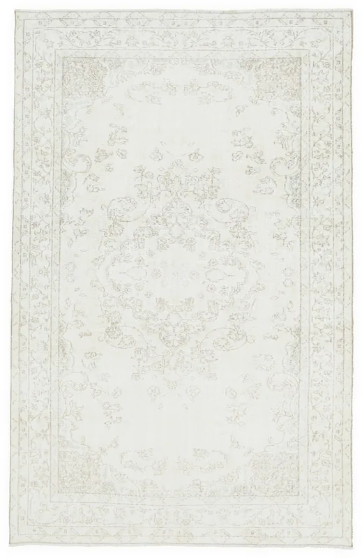 Full overhead view of the hand-knotted vintage ivory rug with a subtle beige medallion and floral patterns.