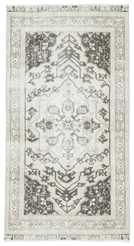 Full overhead view of the cream and charcoal geometric Anatolian area rug