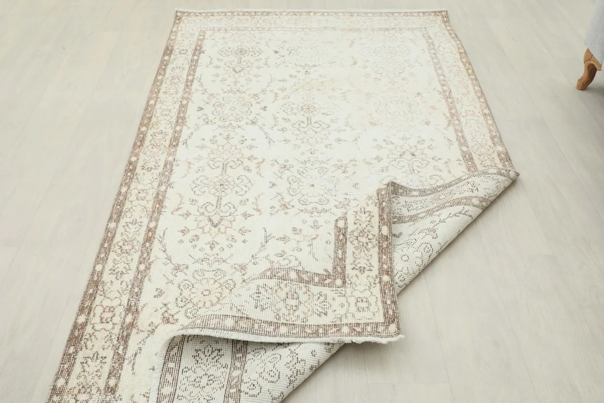 Rug partially folded to showcase its flexibility and the reverse side details