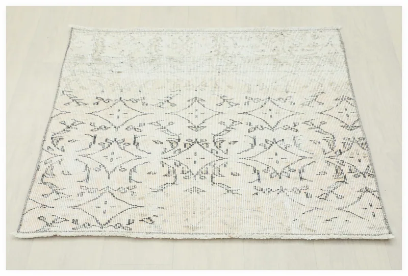 Full top view of the 2'11" x 2'11" ivory and charcoal geometric vintage Anatolian rug on a white background.