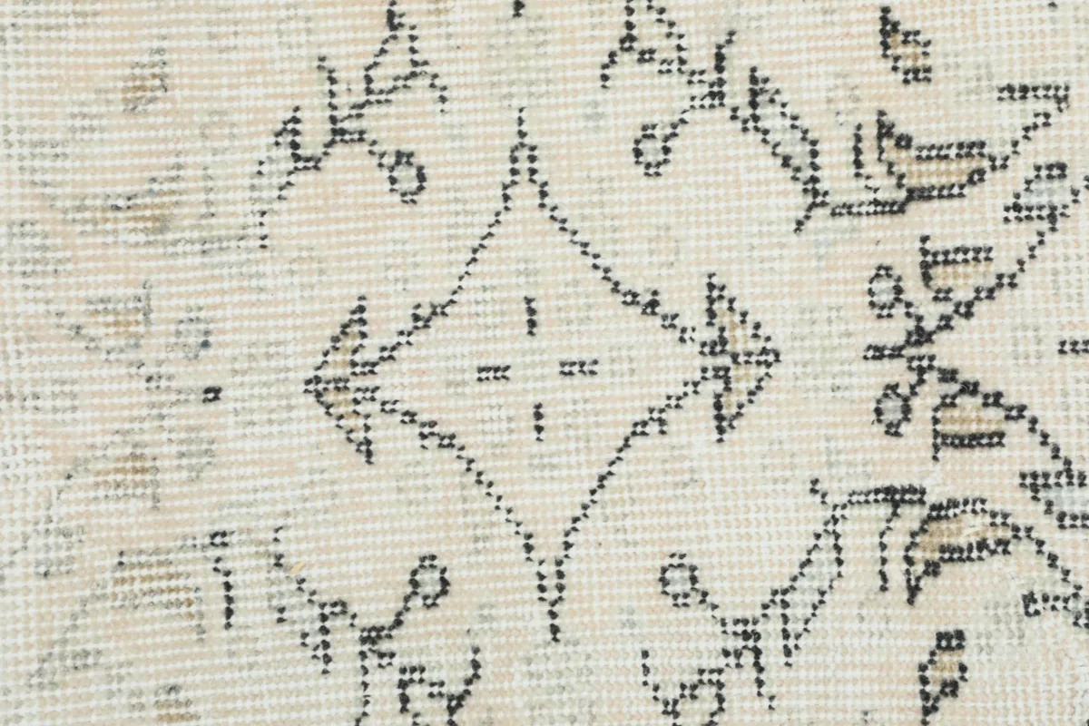 Close-up detail of the low wool pile and hand-knotted texture of the vintage Anatolian rug.