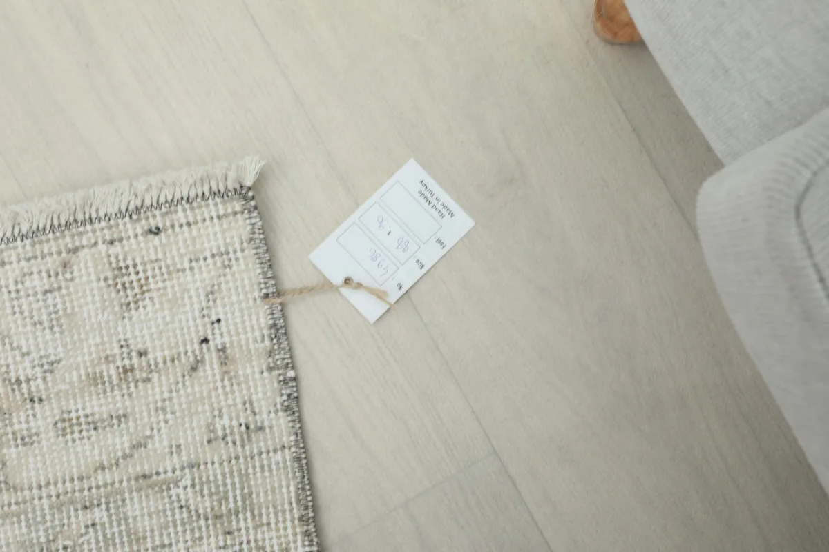 Product tag attached to the corner of the vintage Anatolian rug.