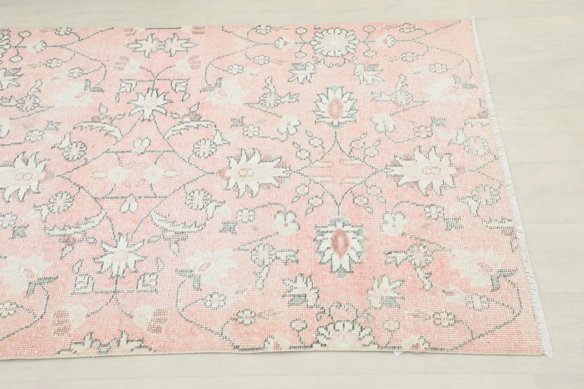 Close-up detail of the rose field with cream, gray, and blue floral and geometric motifs.