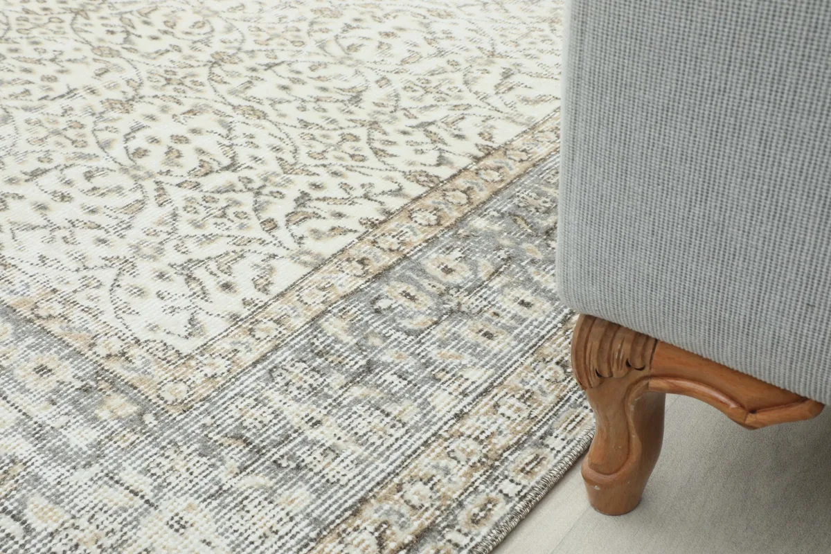 Rug placed under a sofa, showing how it fits into a home decor setting