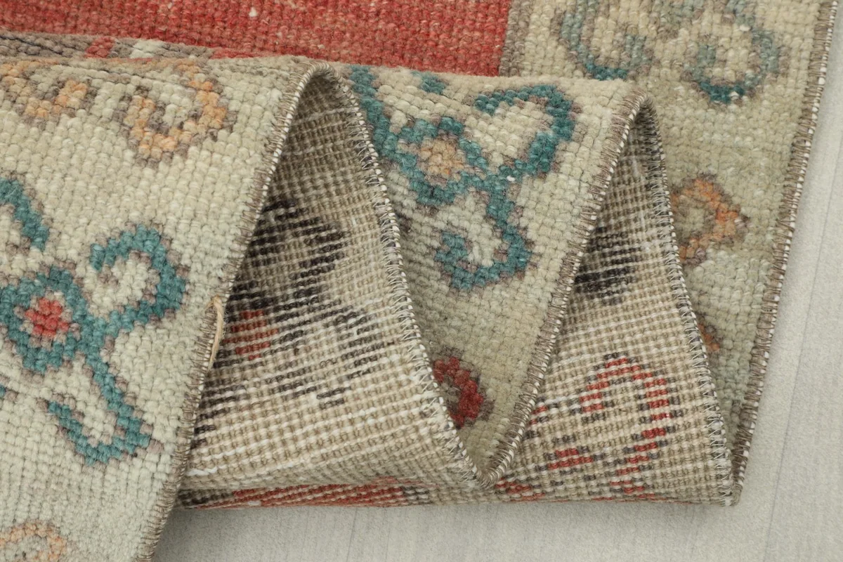 Close-up of the rug's back, showing the consistent hand-knotting and tight weave.