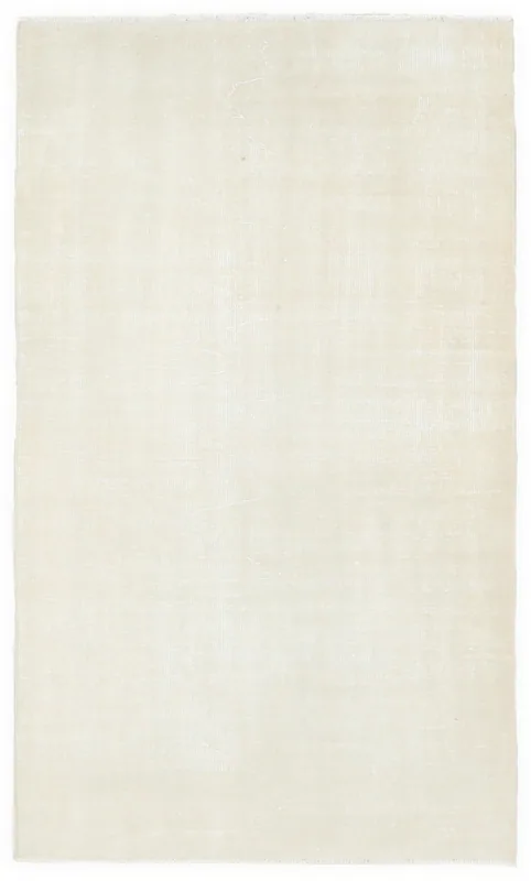 Full overhead view of the 3'7" x 6'2" ivory vintage Anatolian wool rug on a white background.