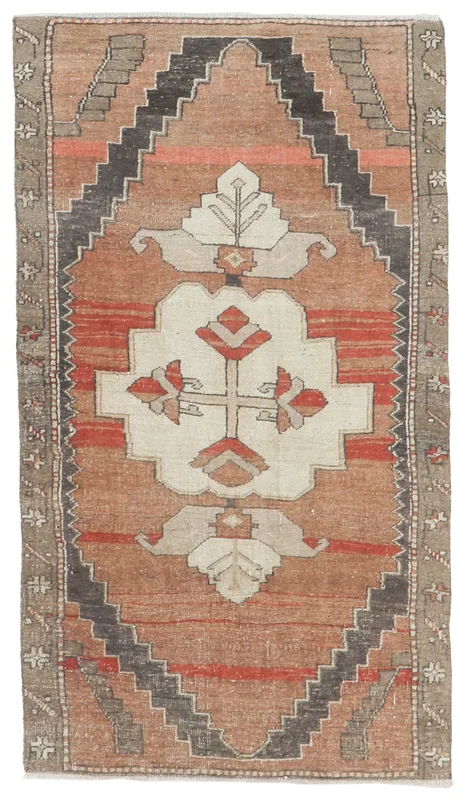 Full top view of the 3x6 vintage Anatolian rug with rust, red, ivory, and gray geometric patterns.