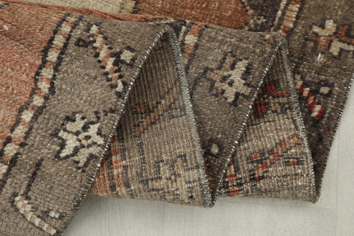 Close-up of the rug's reverse side, showcasing the hand-knotted cotton foundation and weave.