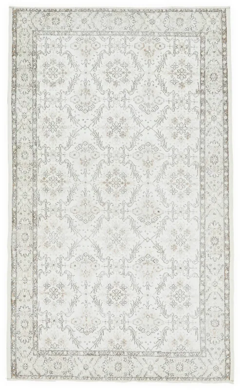 Full top view of the ivory and beige floral vintage Anatolian area rug